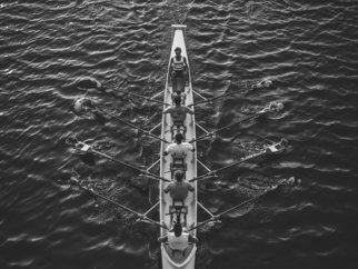 people riding boat on body of water