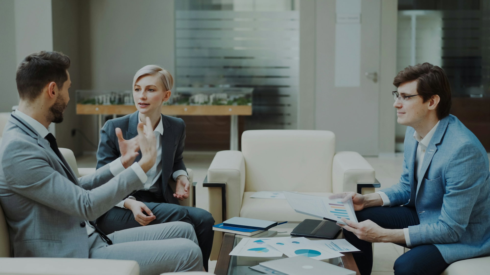 Three business people in a meeting