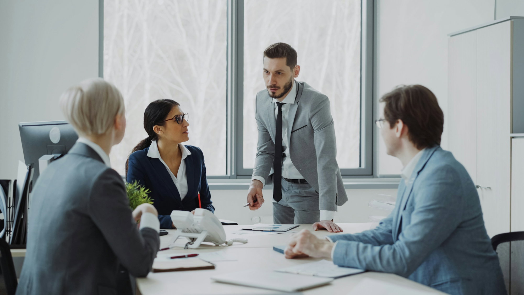 business-professionals-in-a-meeting-around-a-table-.jpg Business professionals in a meeting around a table.